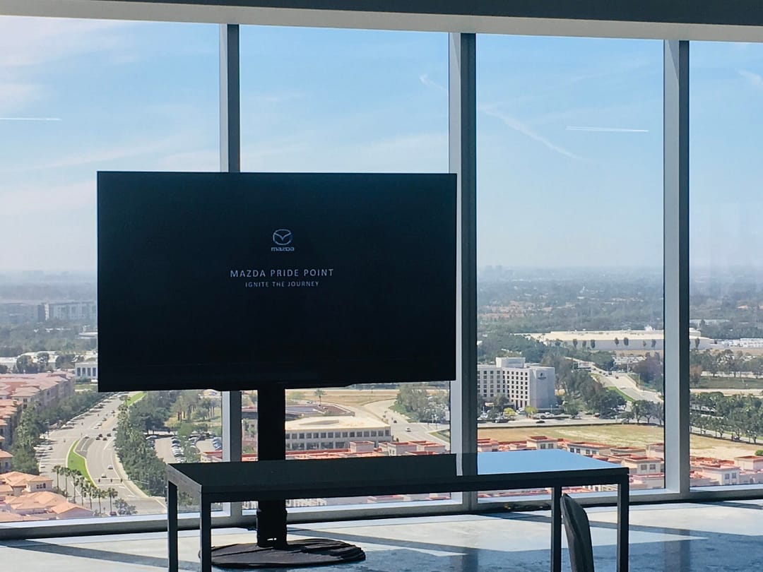 75'' monitor set up for a Mazda event. The background overlooks Orange County, California.