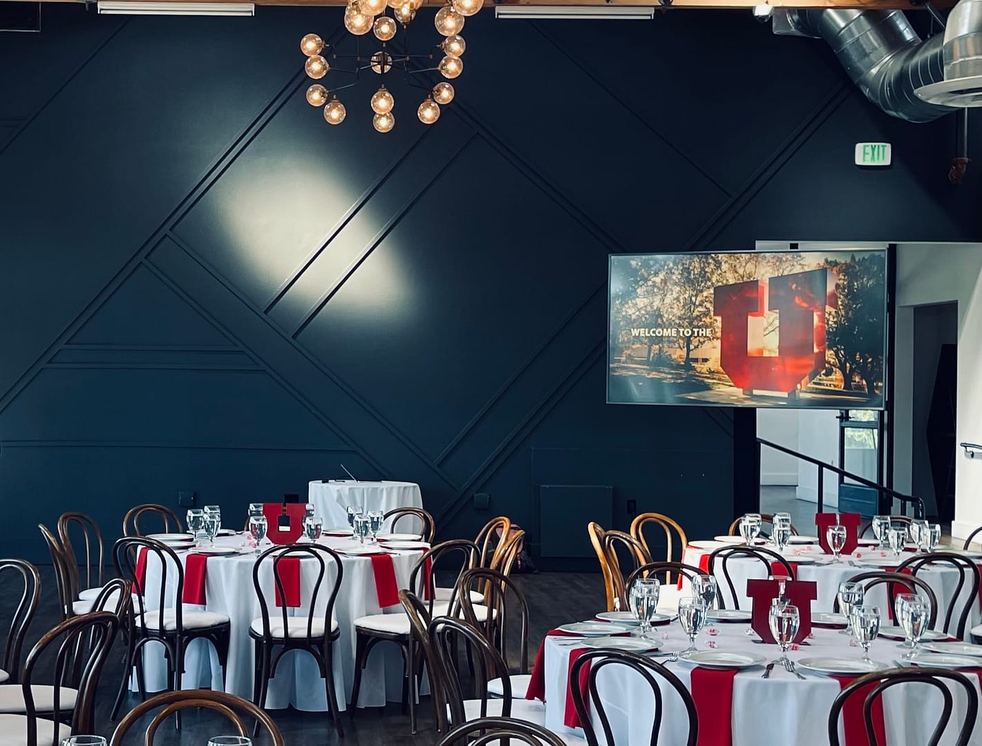 Monitor set up for University of Utah event in ballroom.