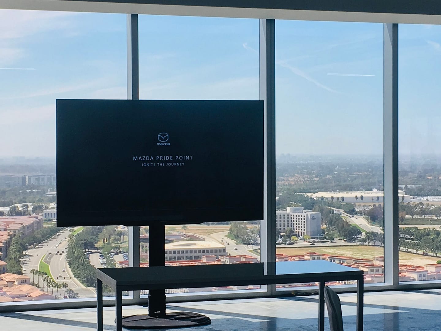 75'' monitor set up for a Mazda event. The background overlooks Orange County, California.