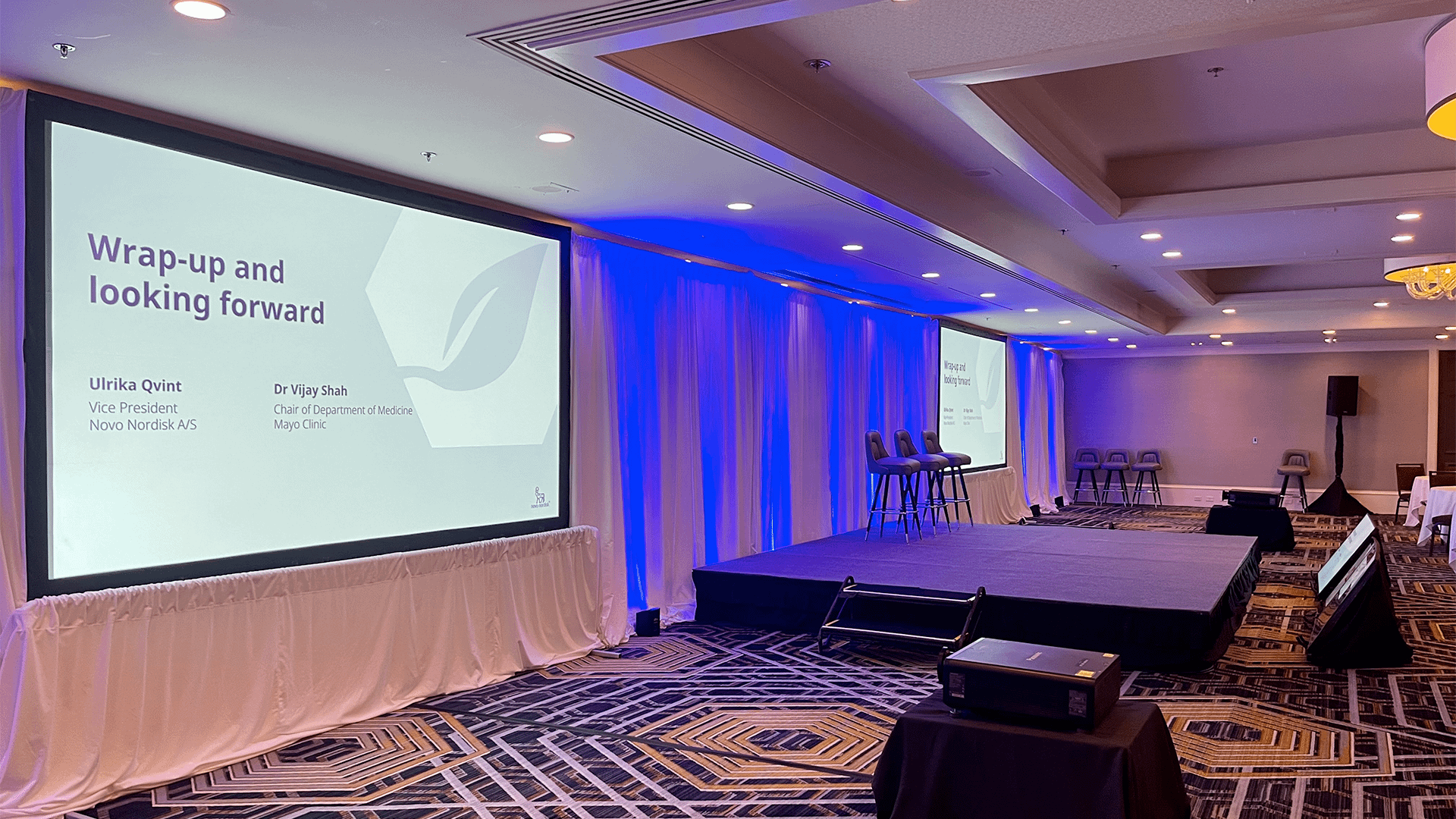 Two projector screen set up in Hotel Ballroom in San Francisco for a Novo Nordisk event.