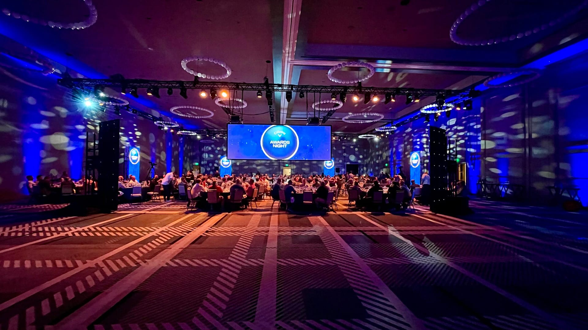 Lighting on walls of buildings for event in Frisco, TX